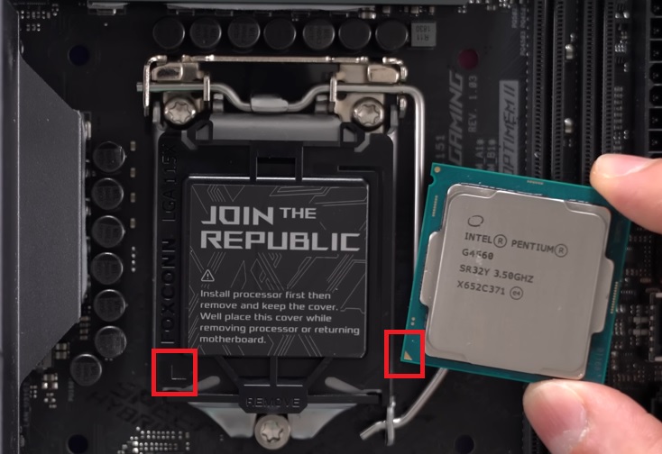 Hold the CPU by its sides