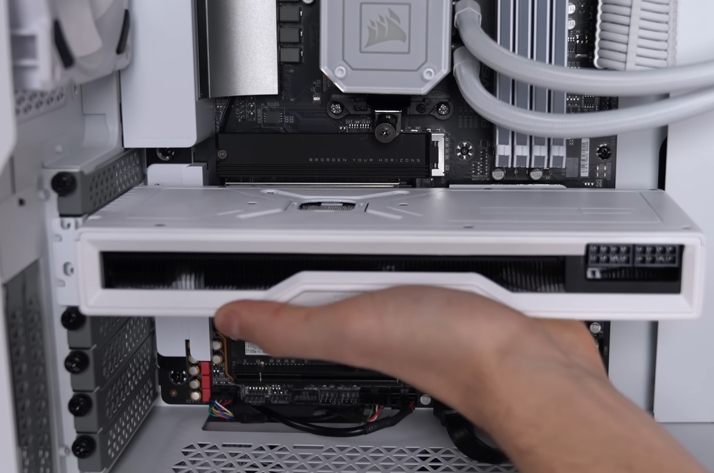 Hold the GPU from the bottom and slide it gently